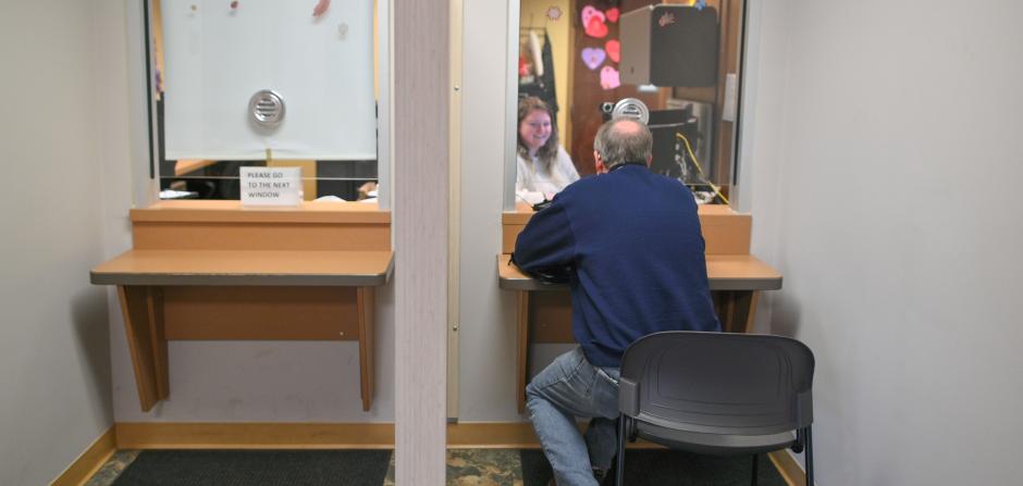 Person sitting at front desk