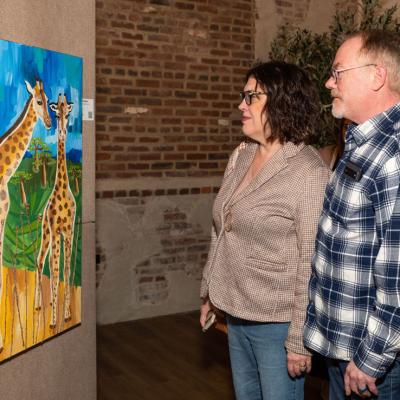 people looking at art