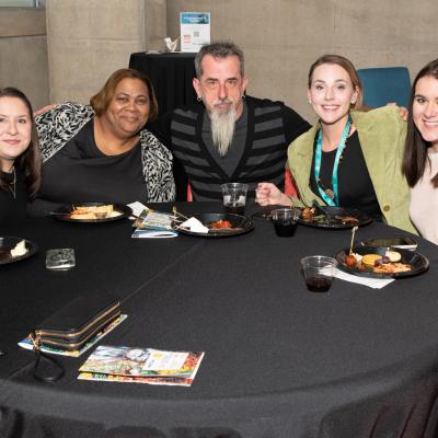 CSS staff sit at a round table at Art of Recovery.