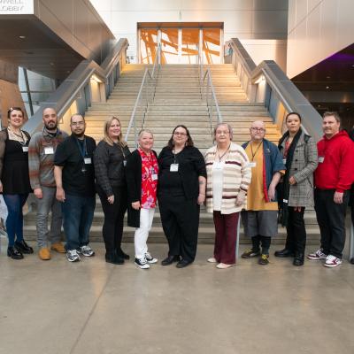 Art of Recovery participants standing in front of a staircase.