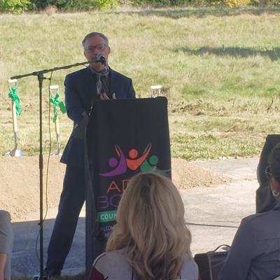 Keith Stahl, CSS director of operations and residential services, speaks from behind a podium.