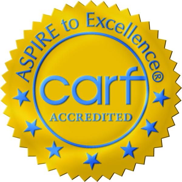 A gold seal with blue lettering and blue stars stating "Aspire to Excellence, CARF accredited", 